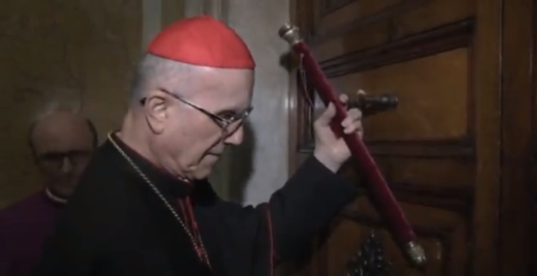 The Camerlengo, Cardinal Tarcisio Bertone, seals off the papal apartments in the Vatican.